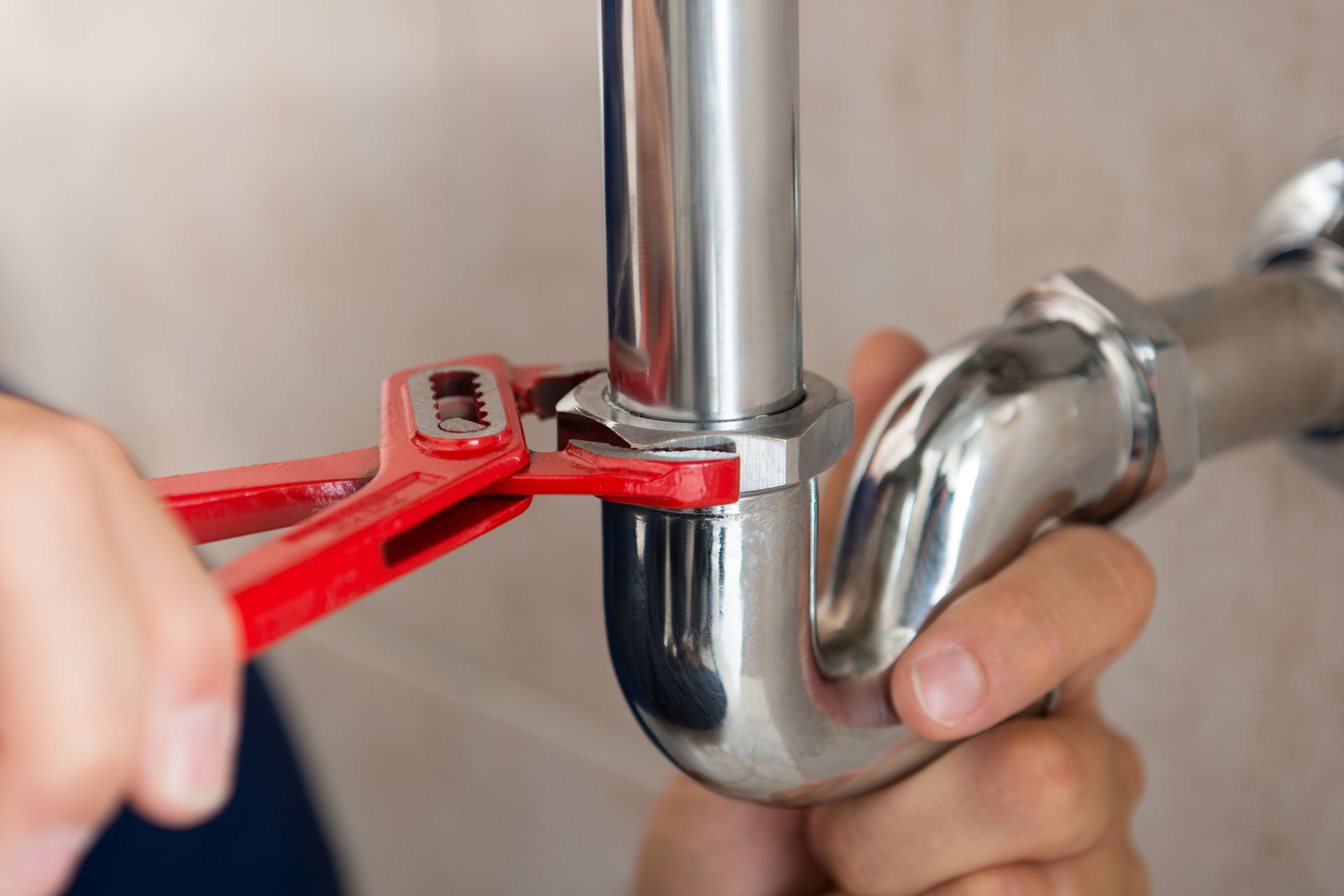 Plumber repairing drain line